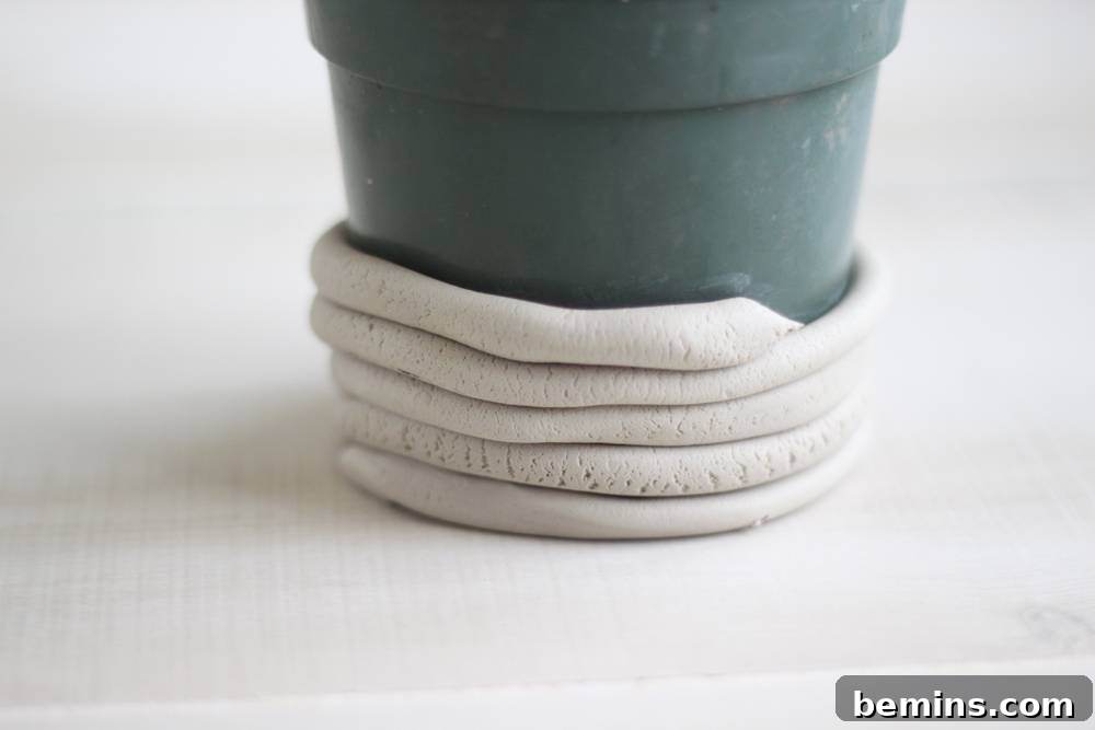 Curiosity Planter: Crafting a Quirky DIY "Bone" Vase 5 Loop the coil around the pot