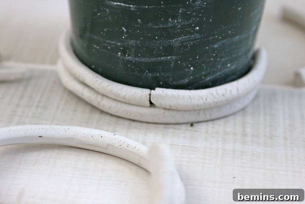 Curiosity Planter: Crafting a Quirky DIY "Bone" Vase 8 Begin placing the broken pieces onto the planter.