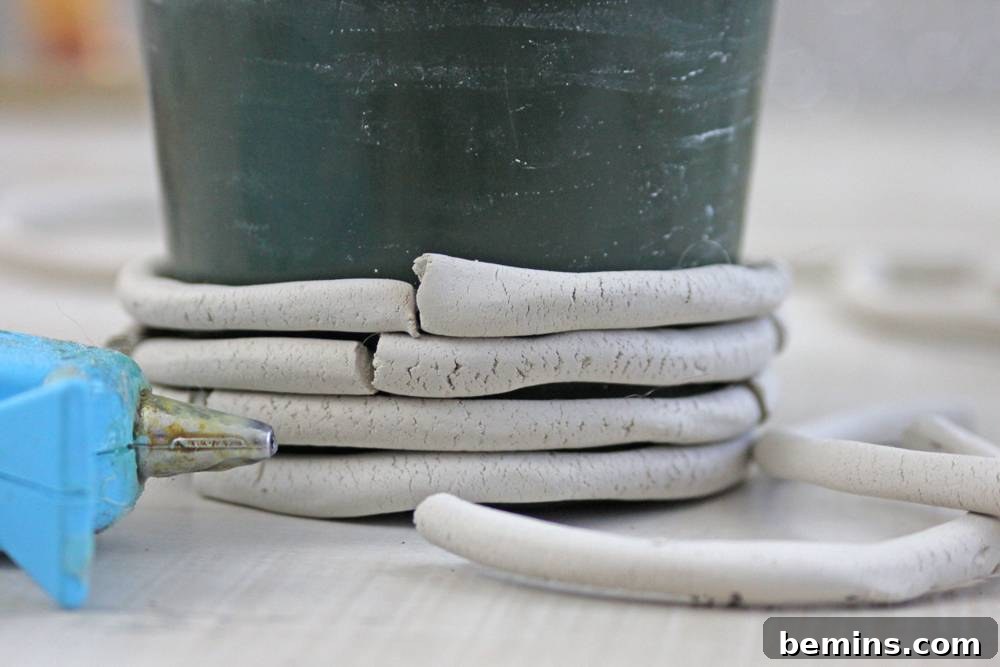 Curiosity Planter: Crafting a Quirky DIY "Bone" Vase 9 Continue layering the broken pieces.