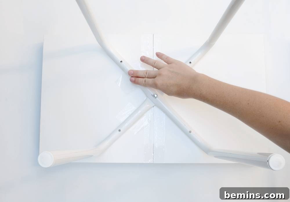 IKEA Hack: Marius Stool End Table Transformation 5 Assembling Marius stool legs for the end table base