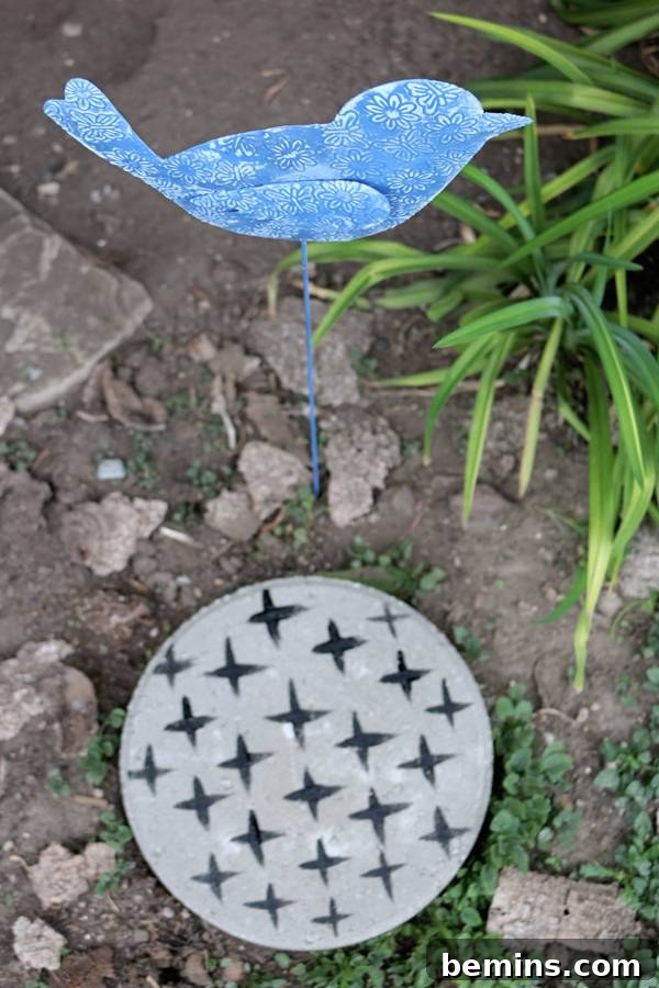 DIY Concrete Stepping Stones: A Creative Garden Path Project 8 Close-up of painted stepping stones in a garden setting.