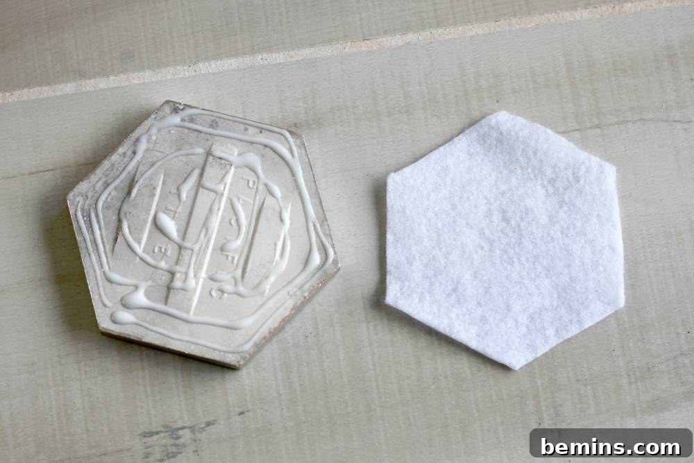DIY Sharpie Coasters: A Creative Home Decor Project 8 Glue the piece of white felt to the bottom of the tiles.