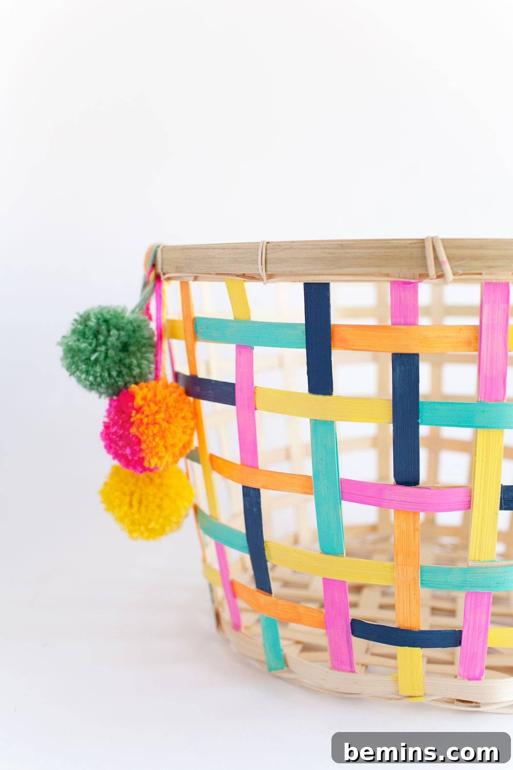 10 DIY Home Decor Projects to Add a Pop of Color 9 DIY Painted Basket with Pom Poms