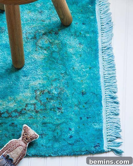 An old rug that has been beautifully over-dyed in a vibrant shade of blue.