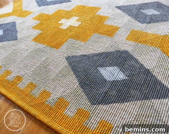 A beautiful yellow mat with a stylish grey geometric design.