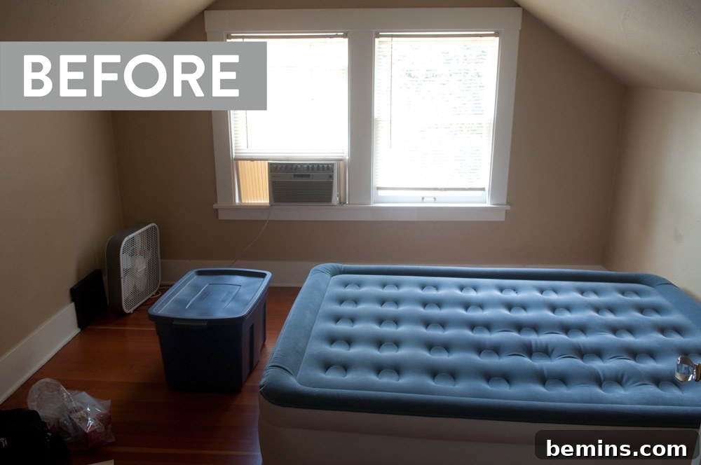 A welcoming blue tote sits in a charming guest room with a slanted ceiling.