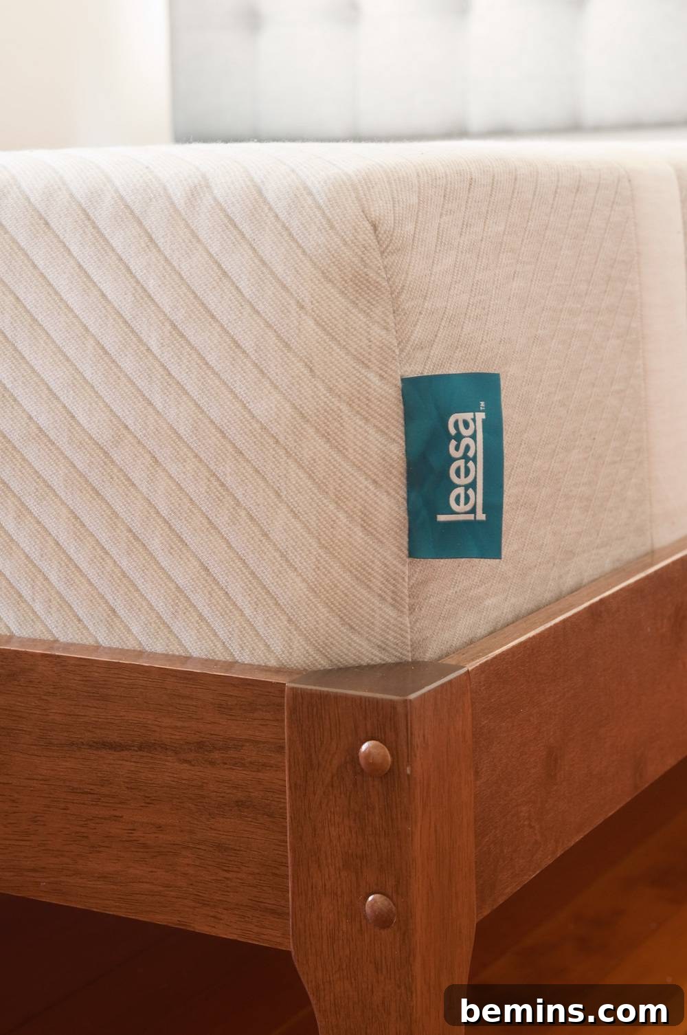 A blue tag on the corner of a new Leesa mattress.