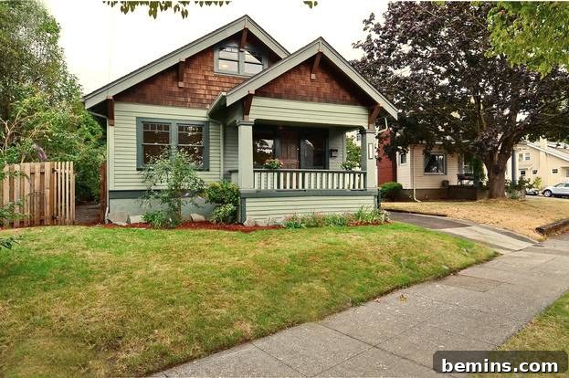 A quaint house with wood and brick exterior nestled behind a sidewalk.