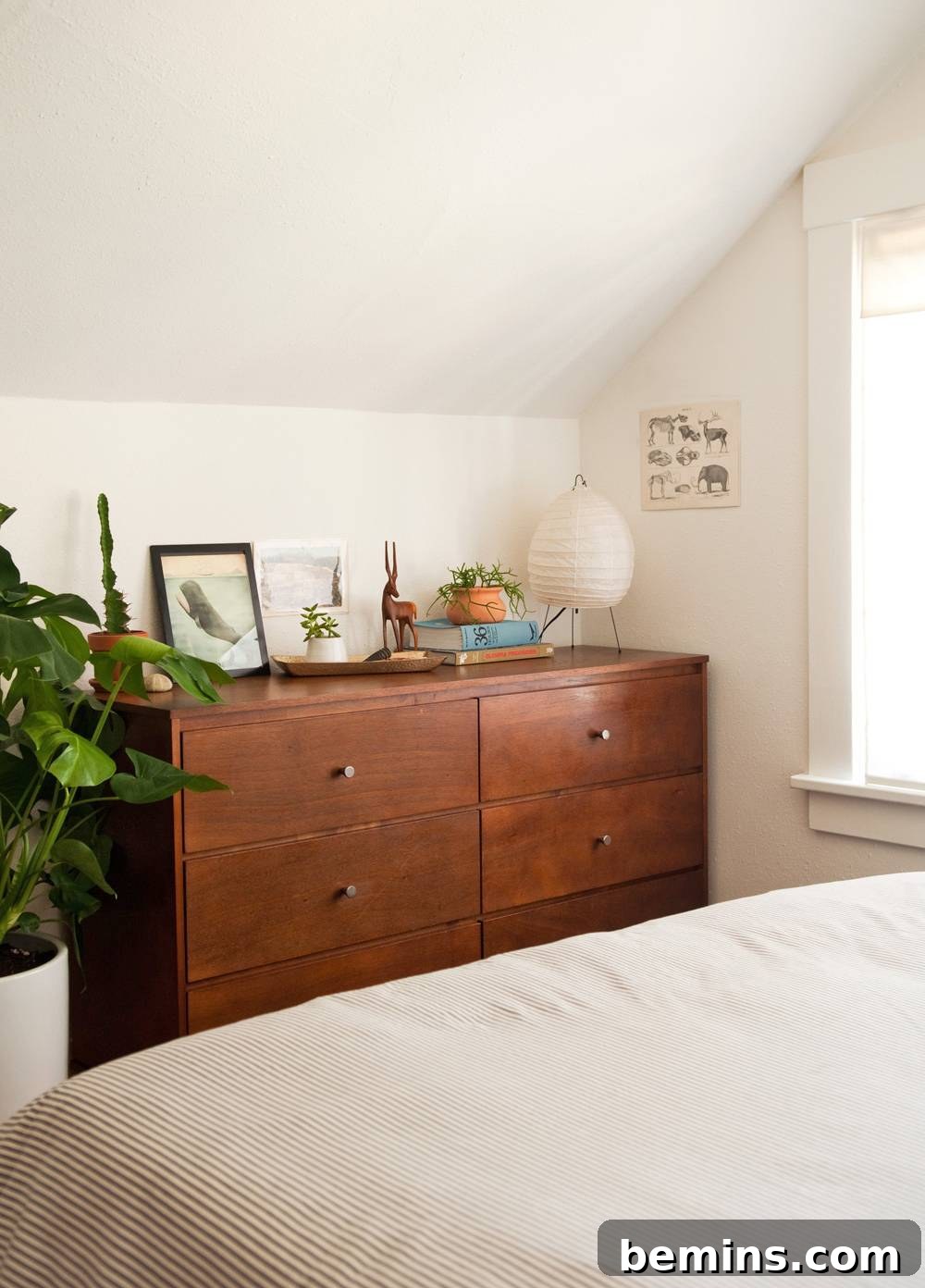 Bedroom with bed and wooden cabin.
