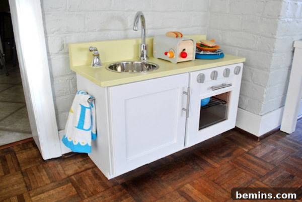 Play kitchen made from an old upper kitchen cabinet