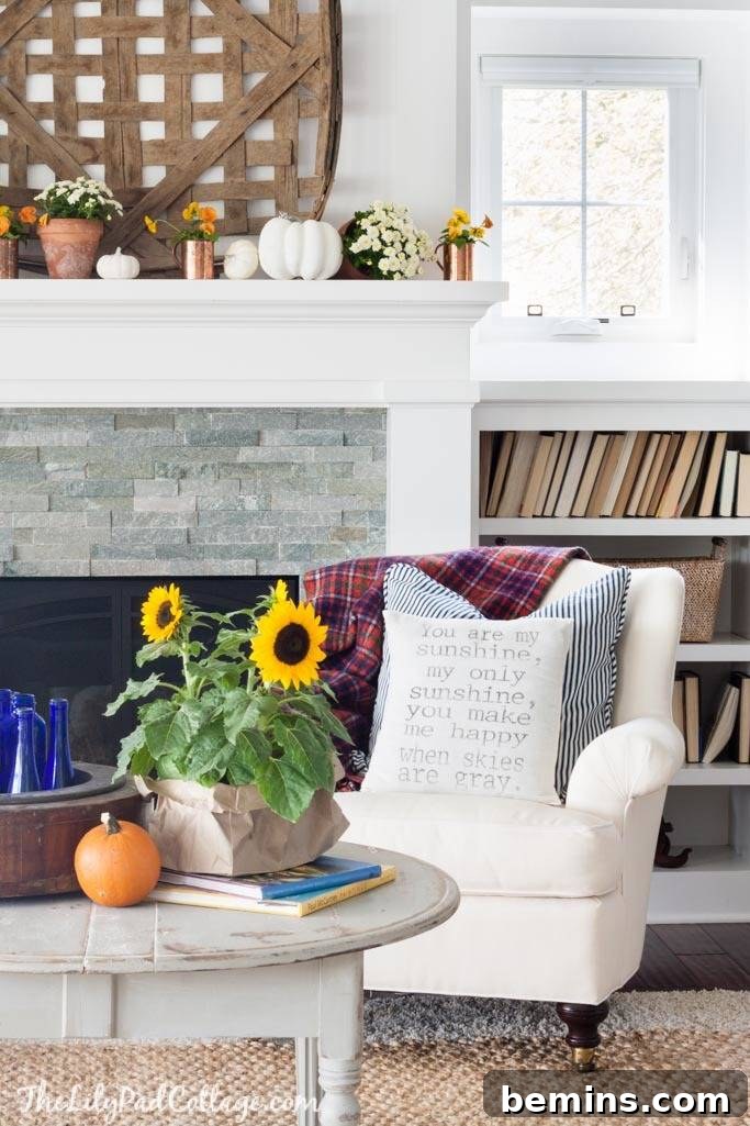 Embrace Autumn: 10 Cozy Room Designs for Fall 3 Fall Decor with Sunflowers, Pumpkins, and Plaid Blanket