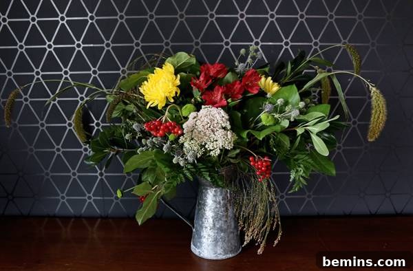 Placing flowers in the vase to create the focal point of the arrangement.