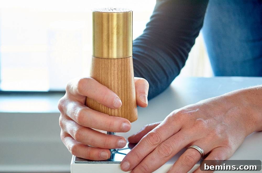 A person using a tool on a picture.