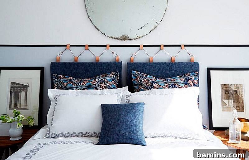 Pillows resting on a white bed with a striking blue headboard.