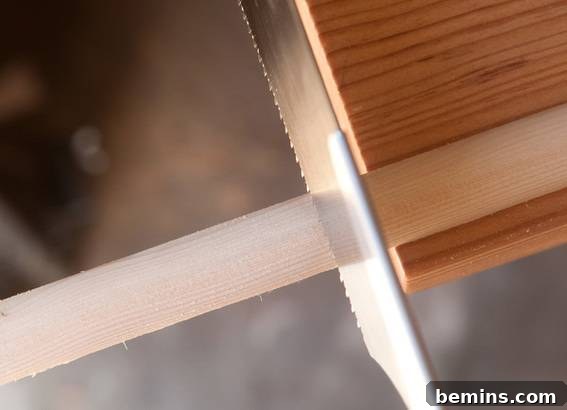 Crafting a Retro-Inspired Display: DIY Pull-Down Map Frame 4 Cut wood trim to length for poster frame