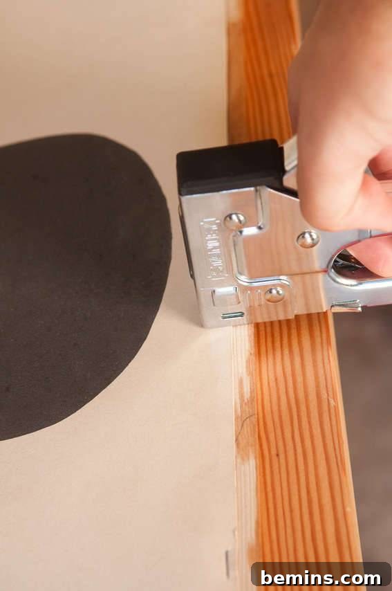 Crafting a Rustic Display: DIY Pull-Down Map Frame for Art 7 Step 5 - stapling the molding