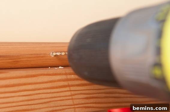 Crafting a Rustic Display: DIY Pull-Down Map Frame for Art 10 Predrill the eye hook hole