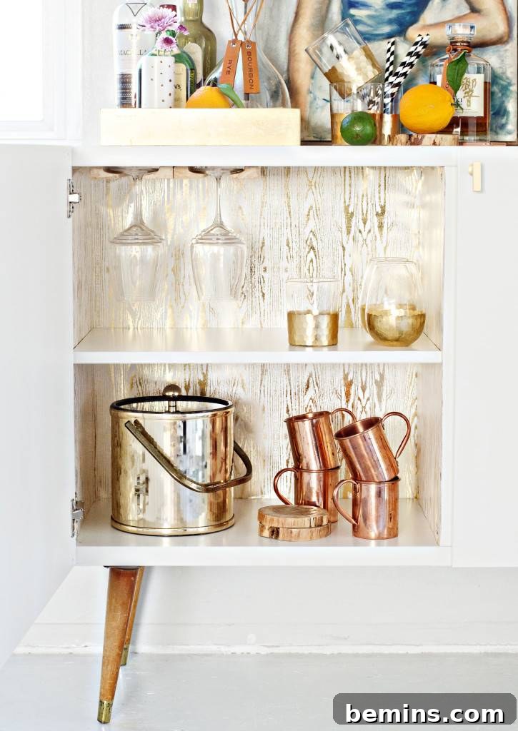 10 Genius IKEA Upgrades That Don't Scream IKEA 7 Stylish mid-century modern bar cabinet created from an IKEA Besta cabinet