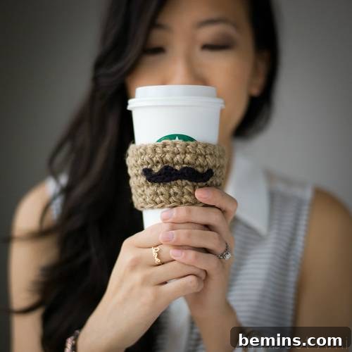 Crocheted mustache cup cozy made from yarn scraps
