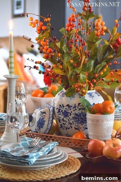 Stunning Autumn Table Decor Ideas 5 Fall tablescape with blue accents complementing warm oranges and reds.