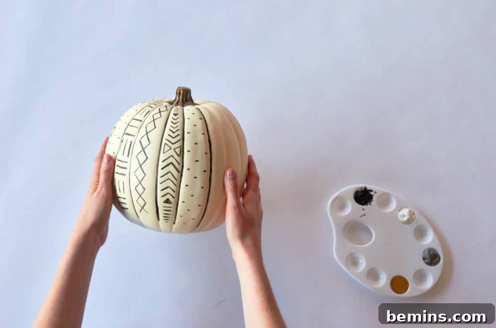 a girl holding a white pumpkin