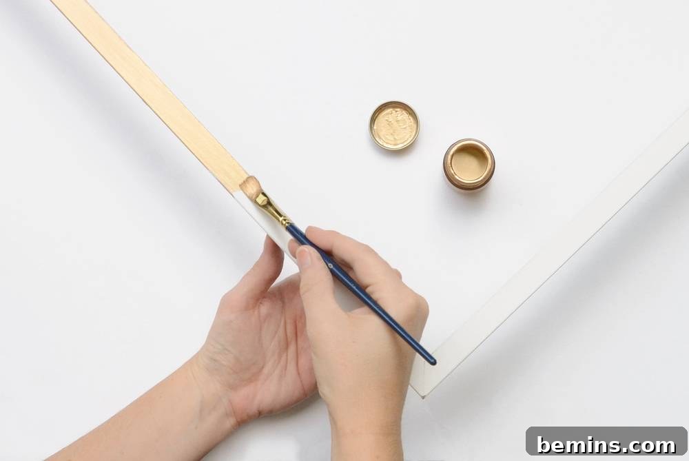 IKEA Frame Fright: Crafting a Chic Halloween Wreath 6 Painting the Frame with Gold Liquid Leaf