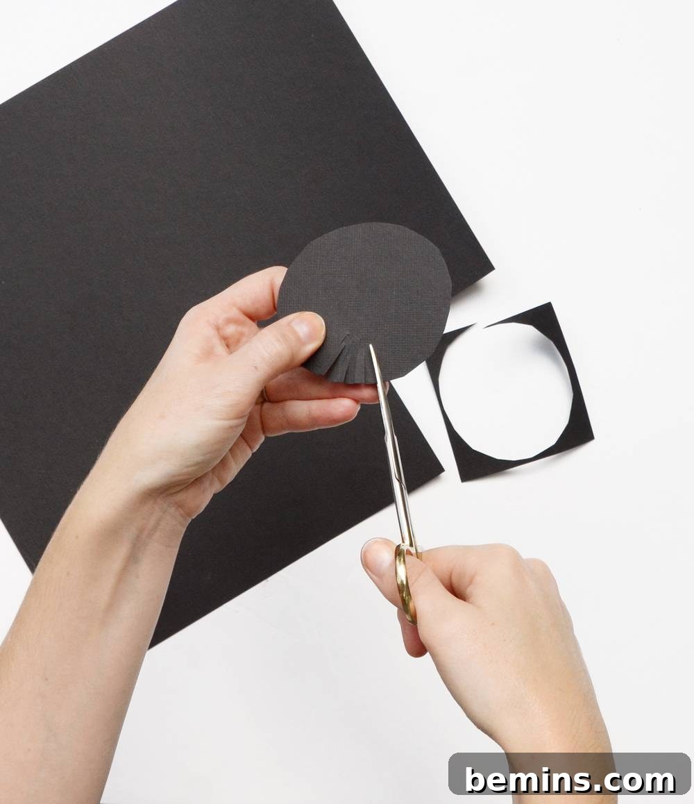 IKEA Frame Fright: Crafting a Chic Halloween Wreath 7 Cutting Black Paper Circles for Flower Centers