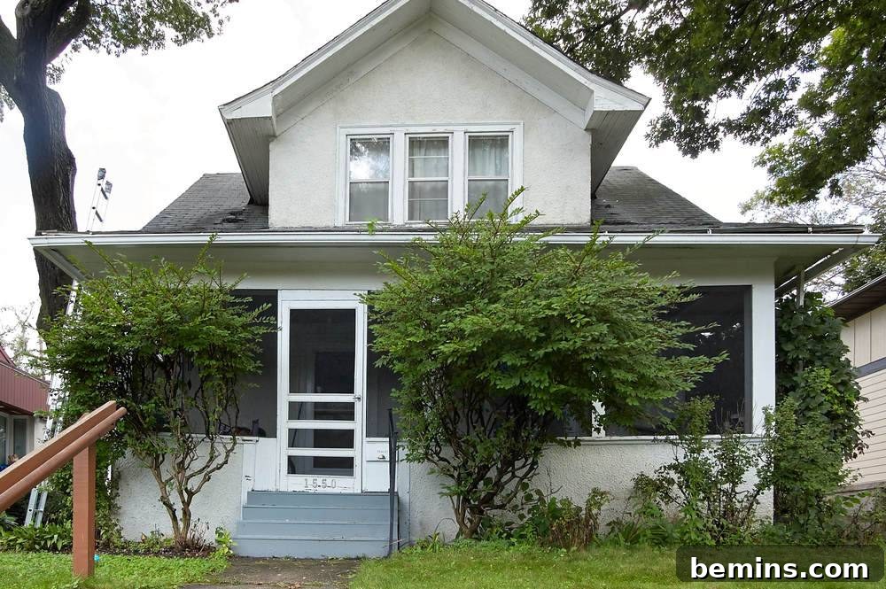 Beautiful house painted in white: Before the transformation - the house with its original white exterior.