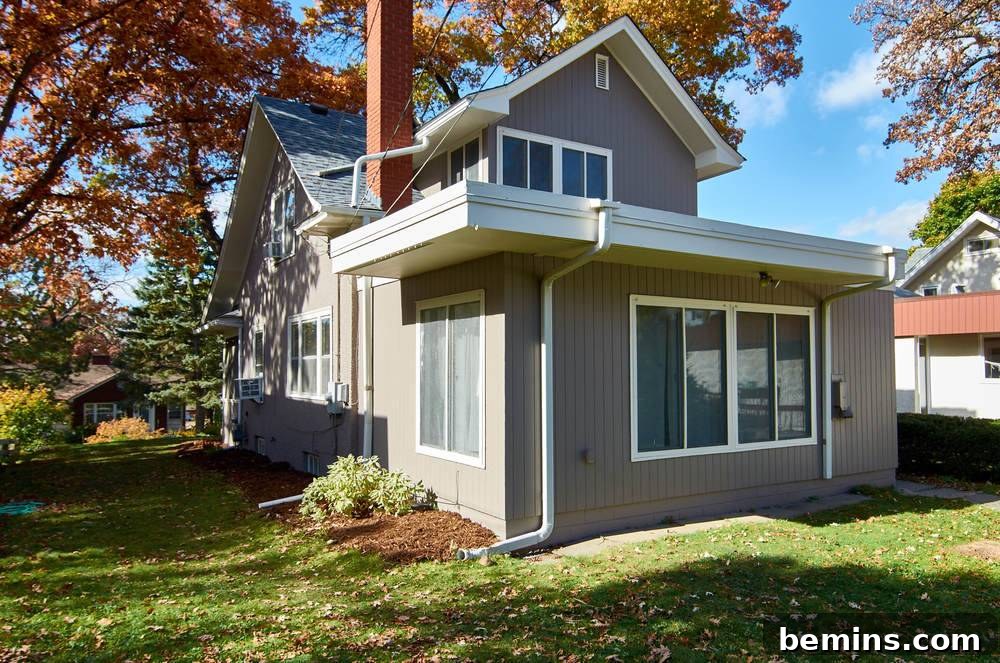 Rear shot - grey body and white trim paint exterior: The back of the house, showcasing the consistent beauty of the paint job.
