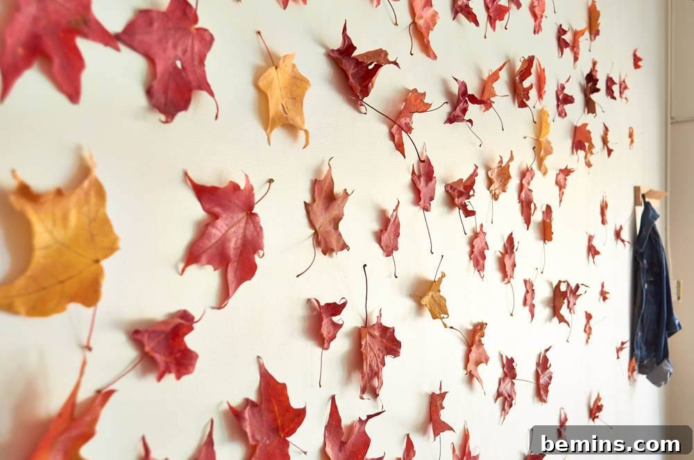 Leaves decorating an otherwise white wall.