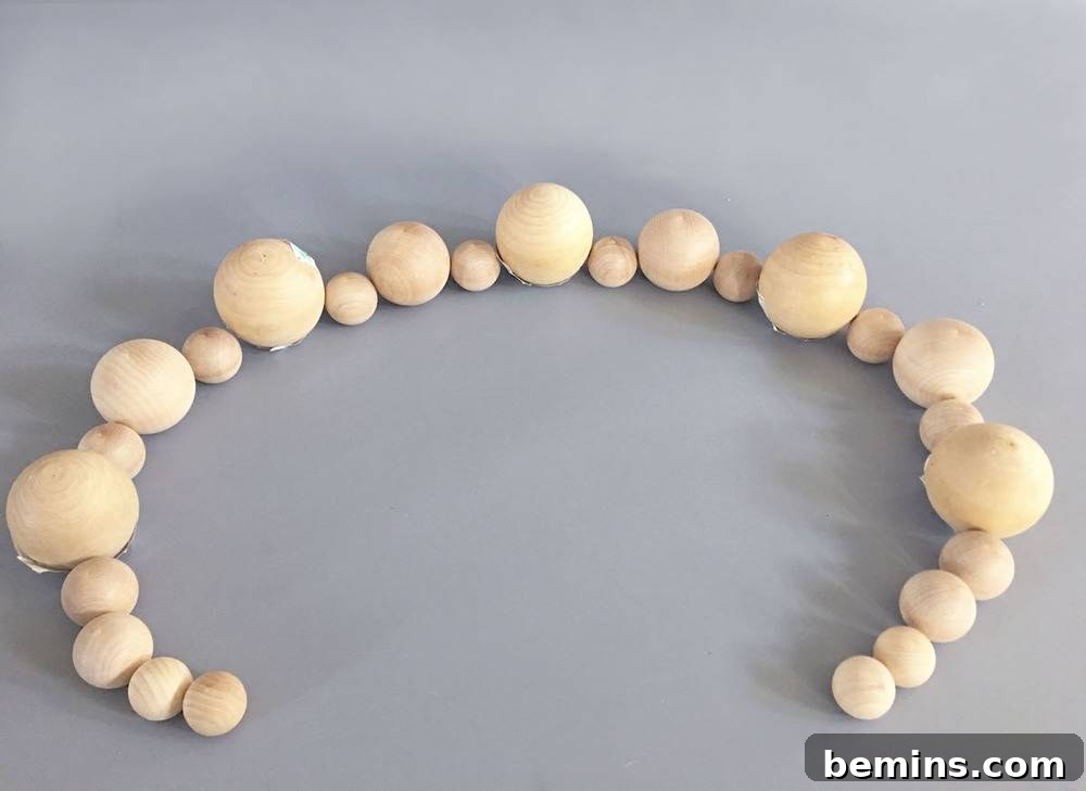 Arranging Wooden Beads to Plan Candle Holder Pattern