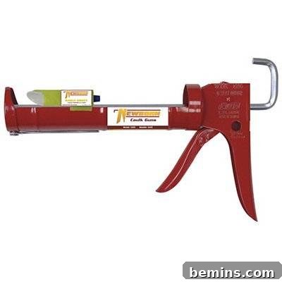 A red metal clamp, showcasing a tool for repairs.