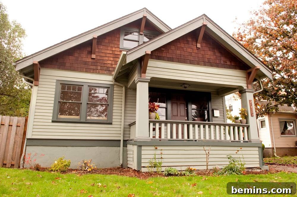Brick and wood house with a lush green lawn.