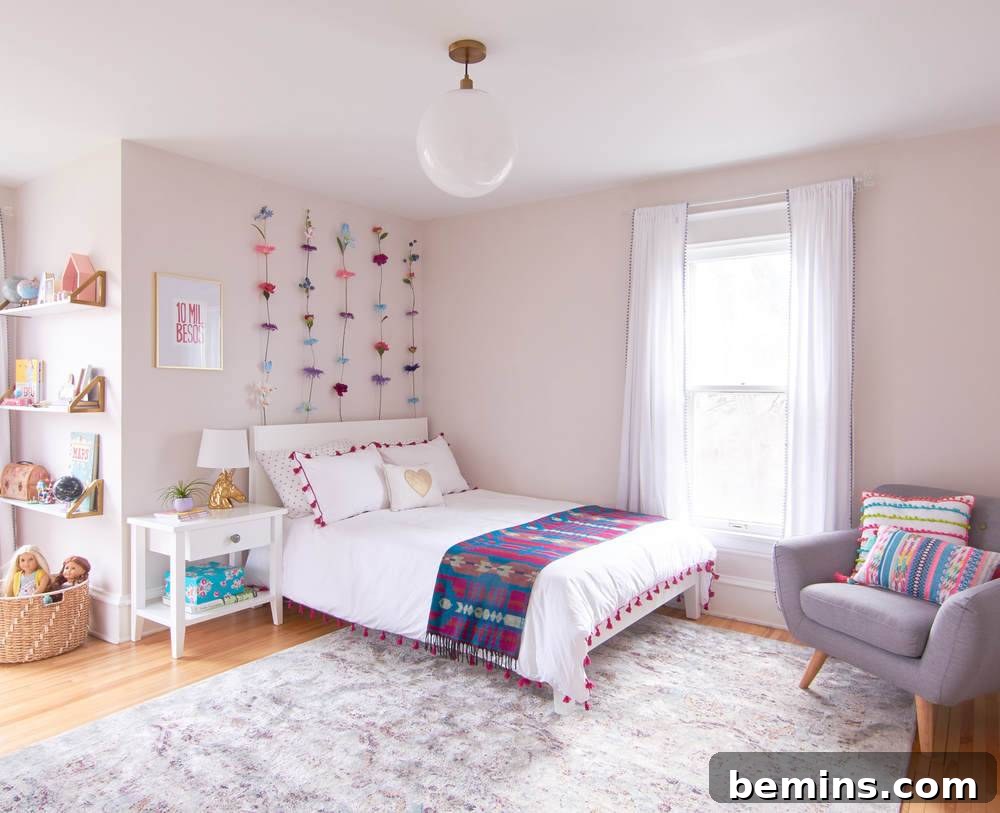 A Whimsical Retreat: Designing a Dream Bedroom for Our Daughter 15 After: A bed in the corner of a bedroom with pink walls.