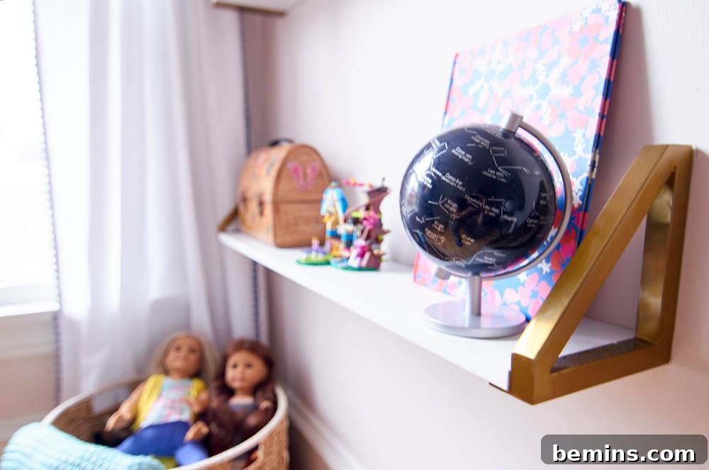 A Whimsical Retreat: Designing a Dream Bedroom for Our Daughter 4 Organized storage solutions in Ayla's room, showcasing dolls and other toys neatly arranged.