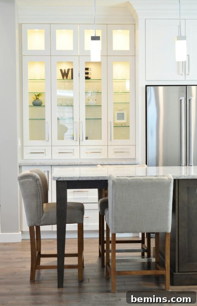 Clean and contemporary kitchen interior with white cabinets and minimalist decor.
