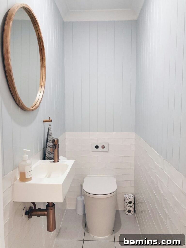 White ceramic sink with stainless steel faucet